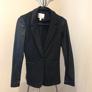 Good condition suit jacket with leather sleeves